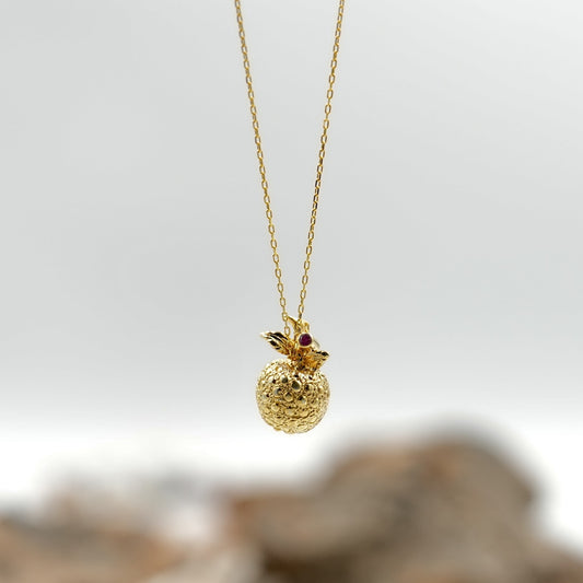 Vintage gold apple pendant with ruby stone